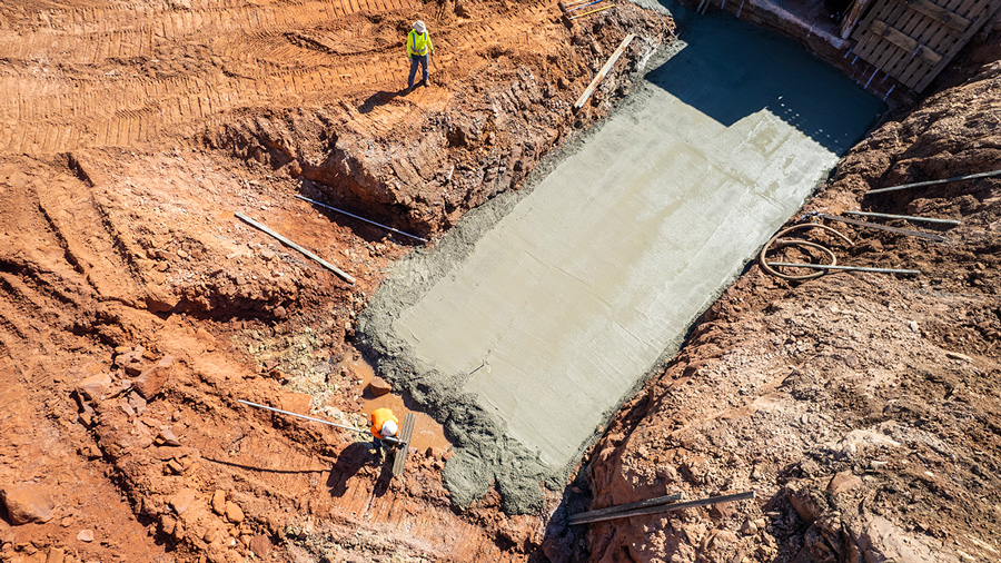 Aerial of cement being poured for a road construction project