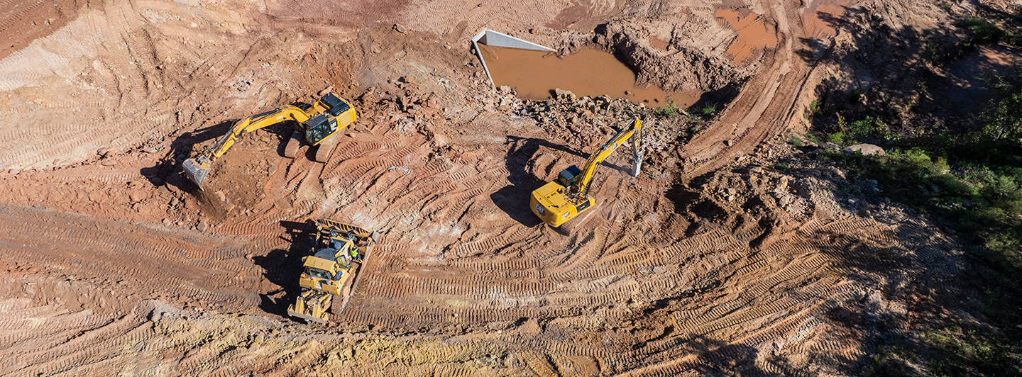 Heavy civil construction machinery moving dirt