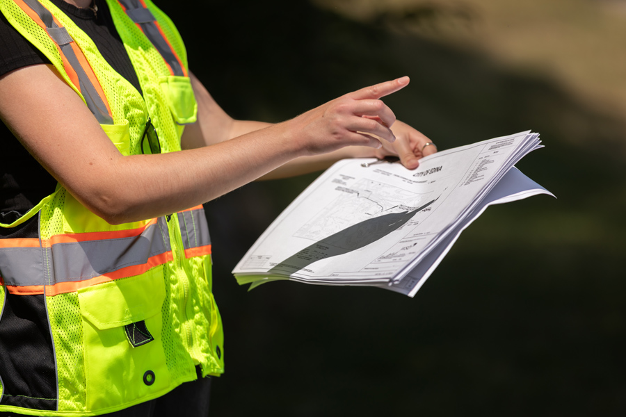 Construction engineer looking at paper plans