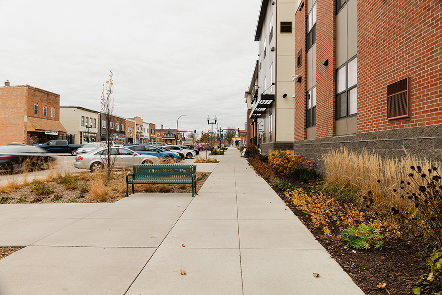Streetscape with sidewalk and bench