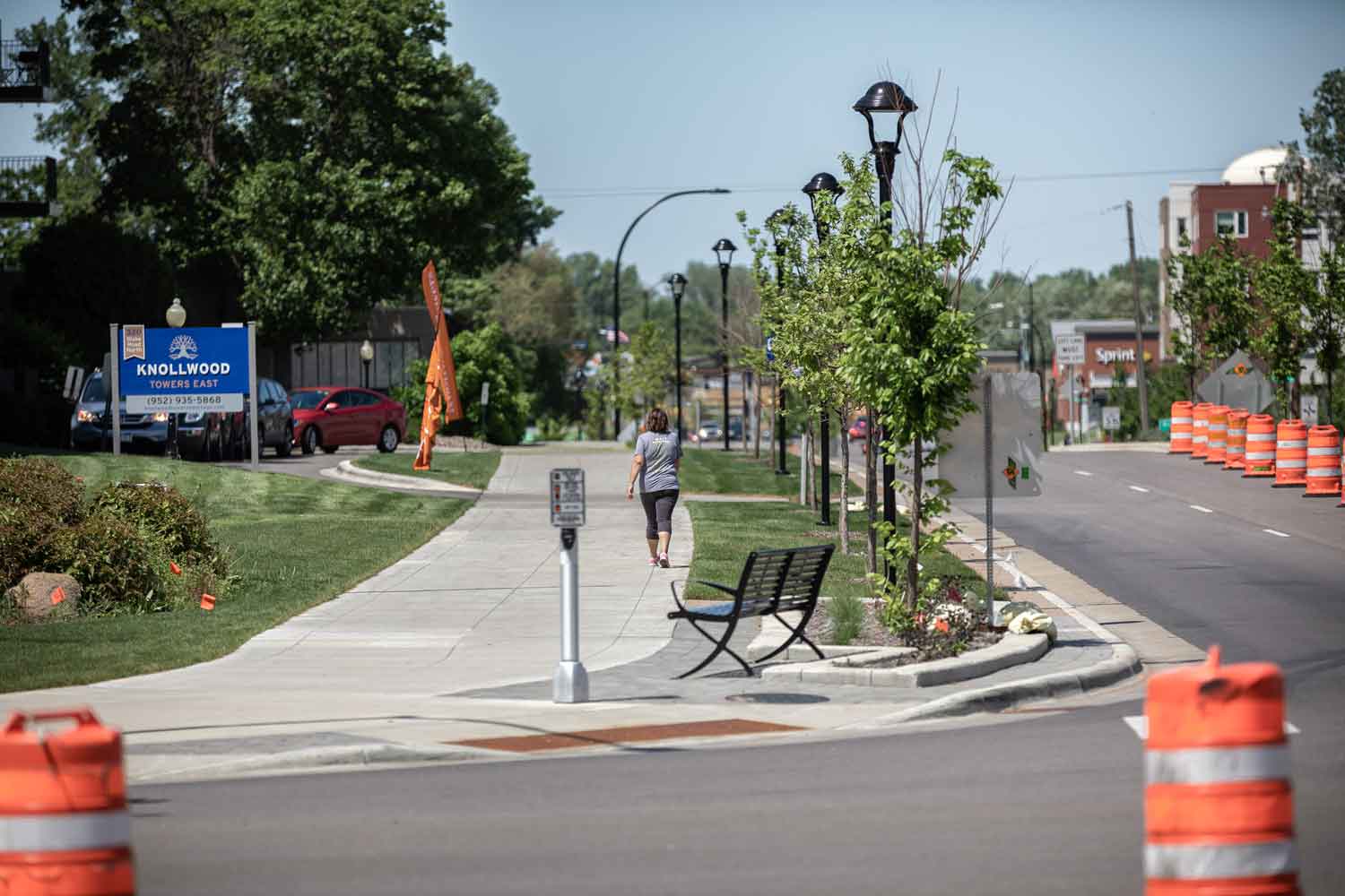 Photo of road and sidewalk in neighborhood.