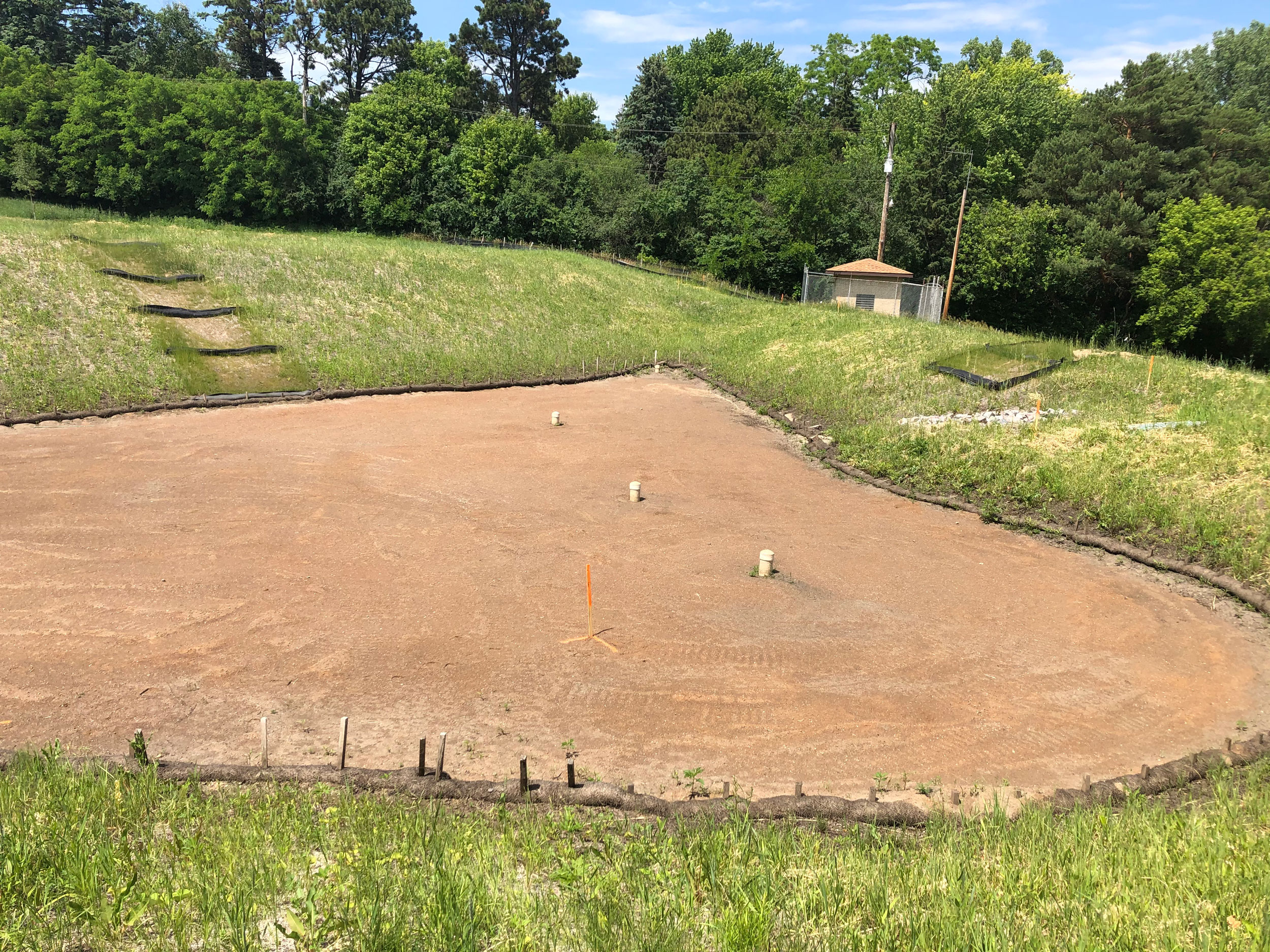Patch of sand next to grass