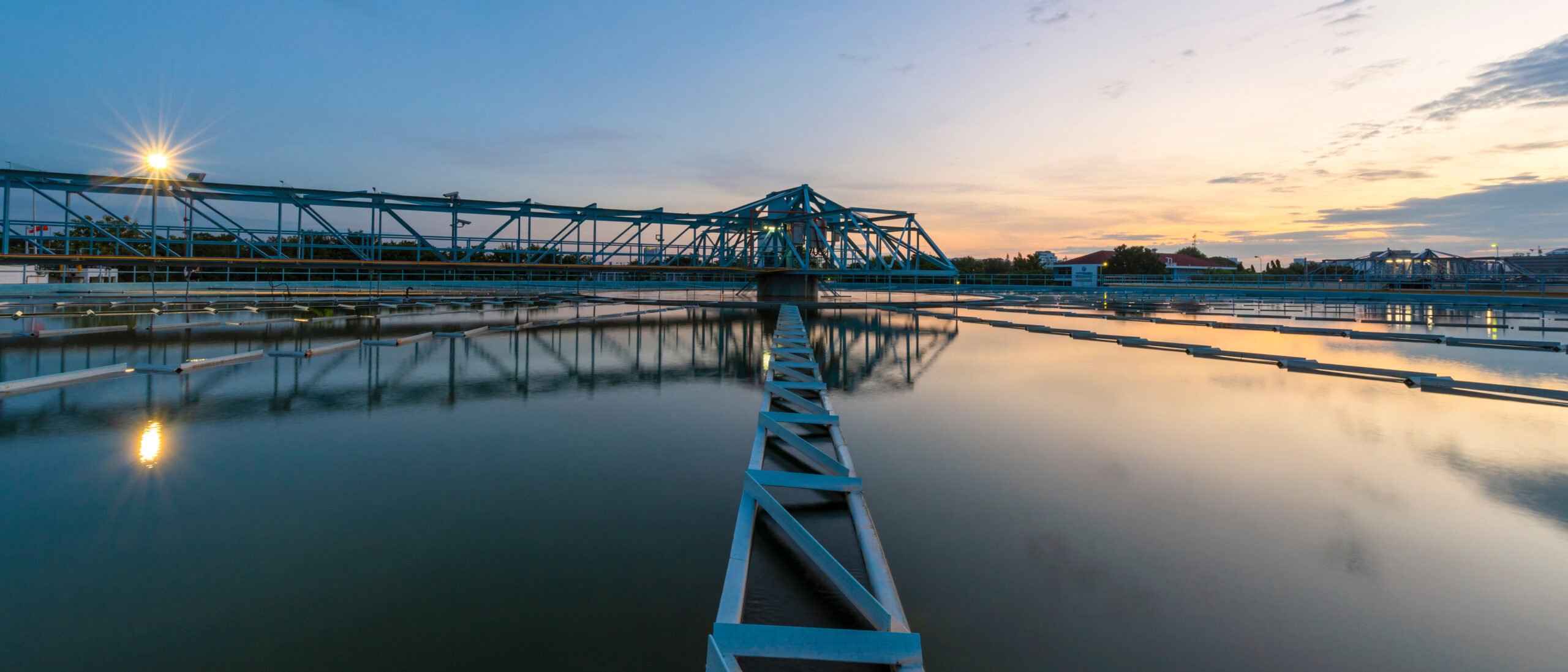 Water treatment plant with sunset