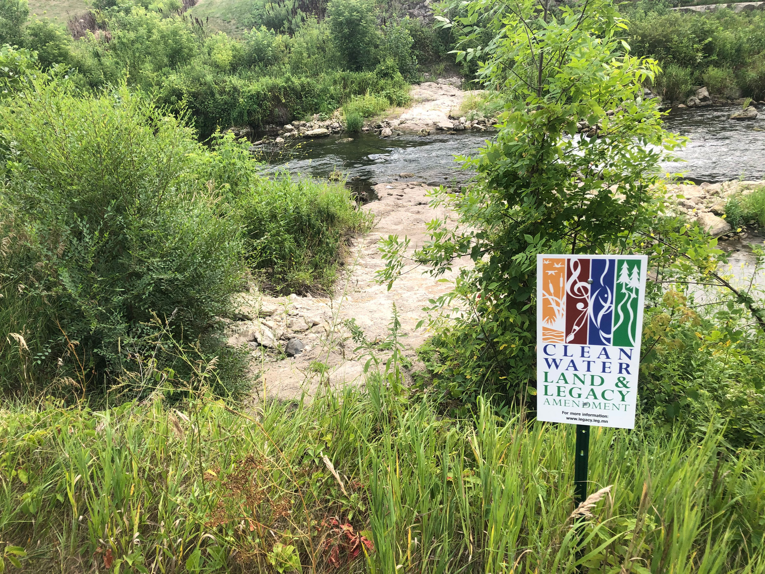 Zumbro river with Clean Water Land and Legacy Amendment sign in the foreground
