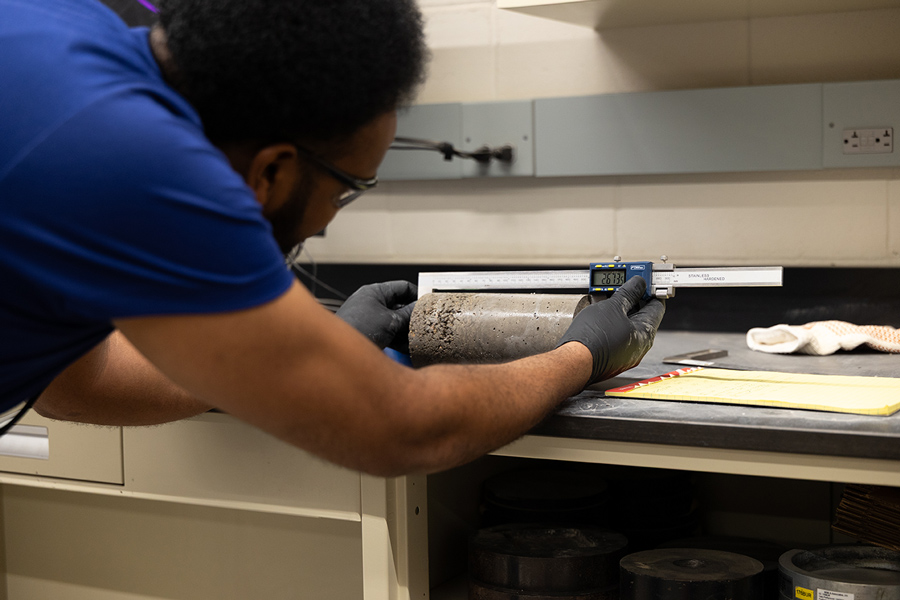 Person working in a lab testing construction materials