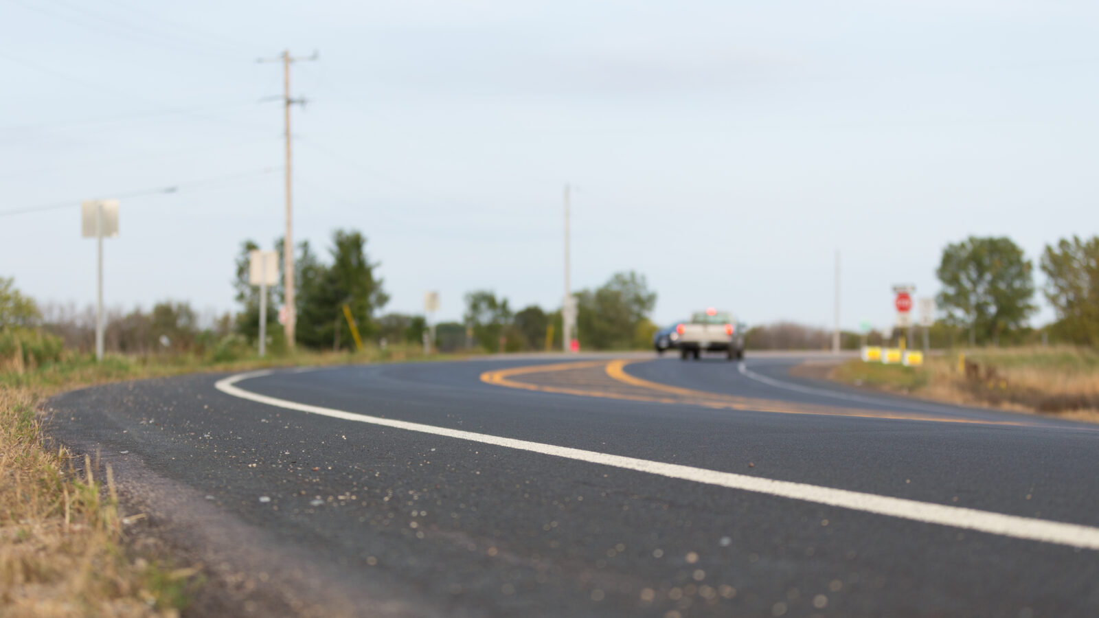 Close up of a street showing asphalt pavement