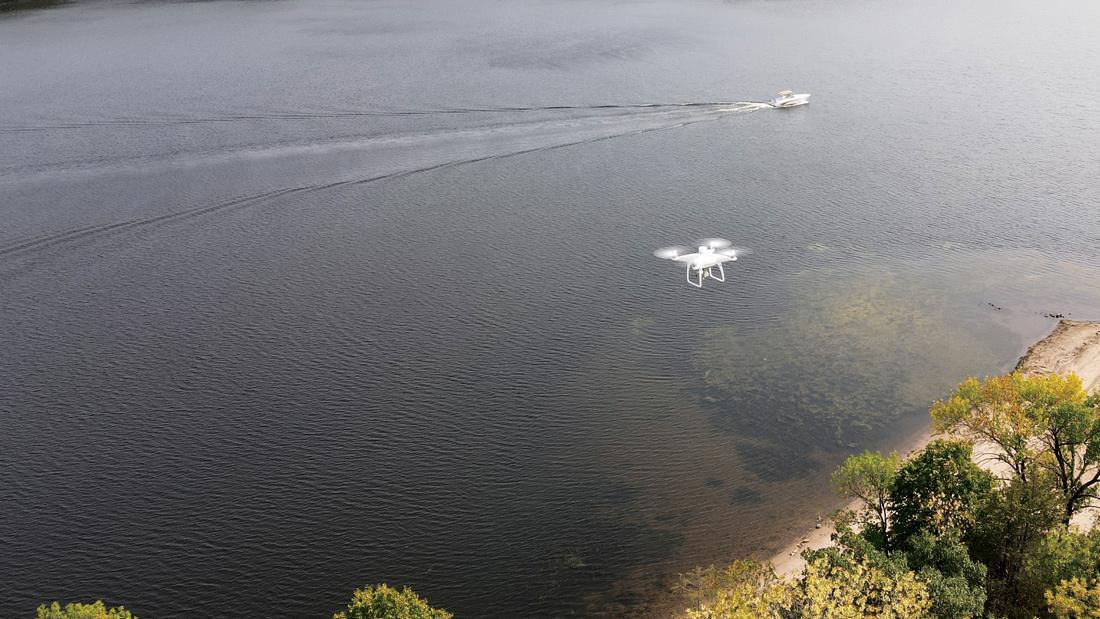 Drone flying above a river