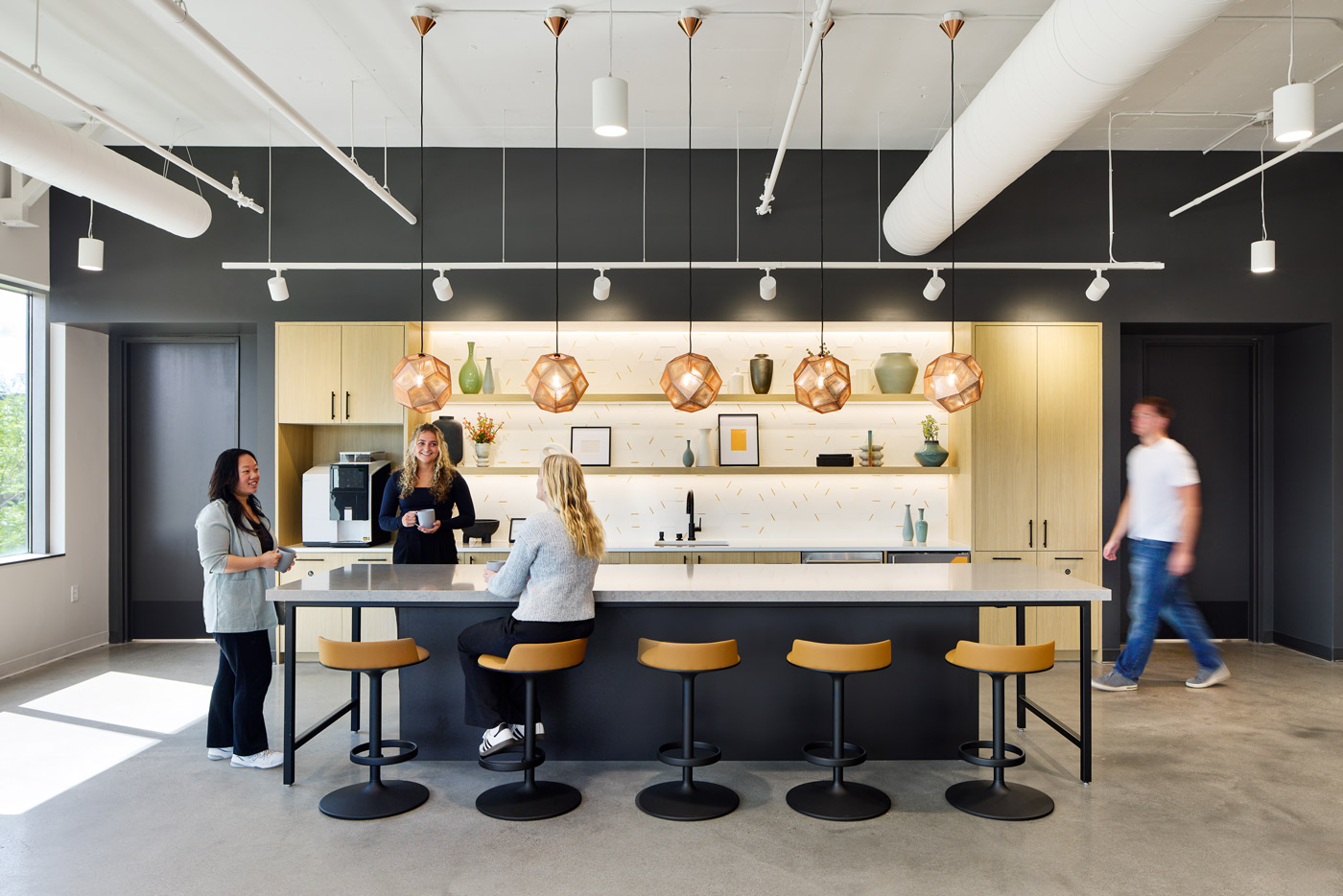 WSB staff standing around a table in a kitchen setting at the WSB office.