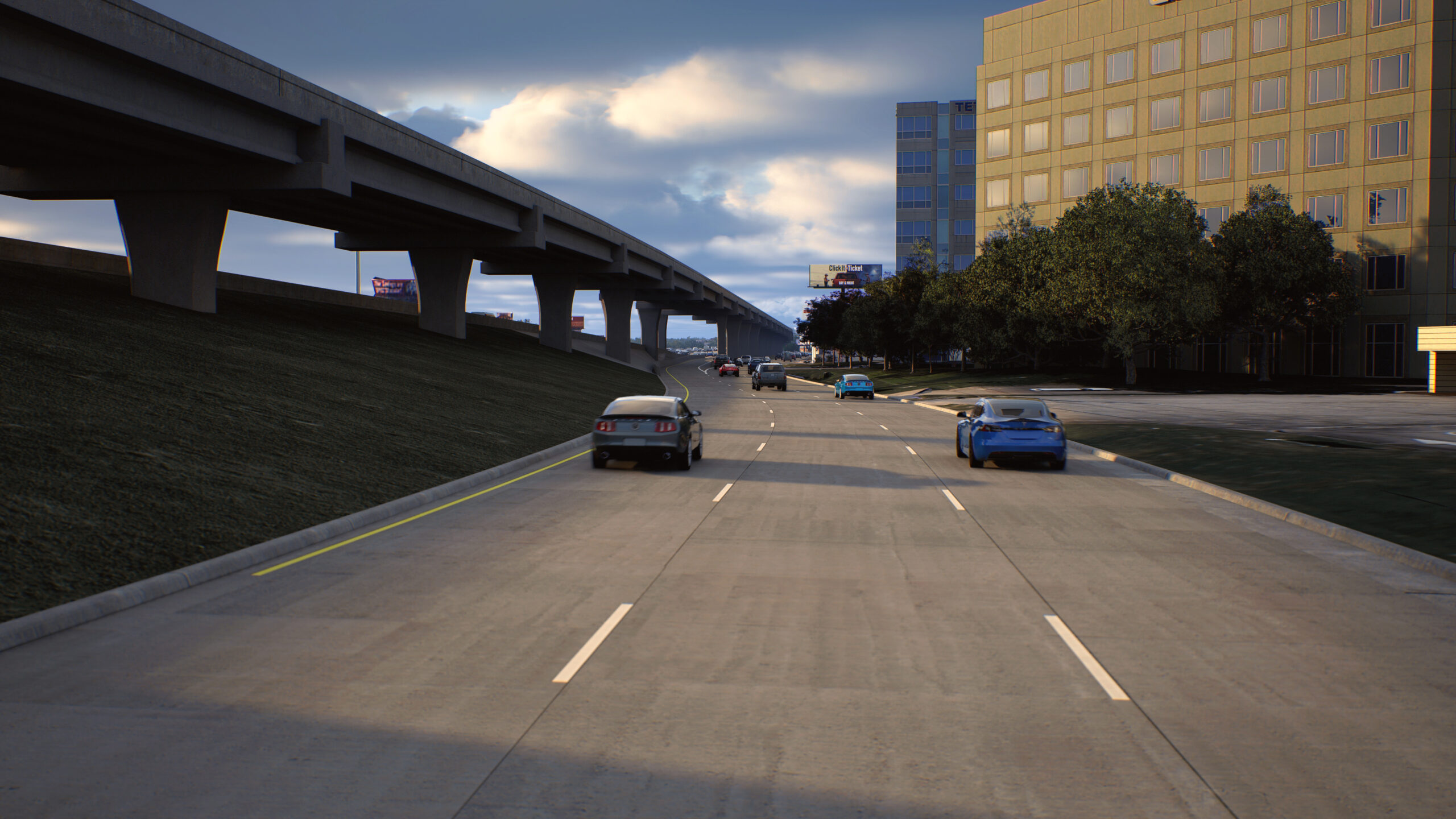 A multi‑lane highway with a few cars driving under a cloudy sky. An elevated roadway runs along the left side, and office buildings and trees line the right side.