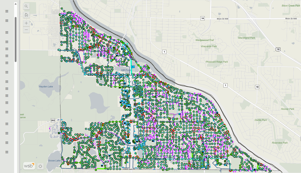 GIS map showing a municipal water system with color‑coded points and lines representing water mains, valves, hydrants, meters, and related infrastructure across a defined service area.