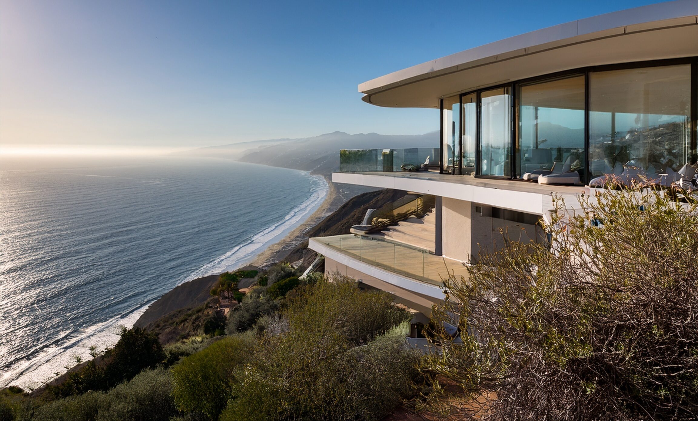 Coastal hillside residence overlooking the Pacific Ocean, showcasing development in terrain that requires geologic and geotechnical evaluation.